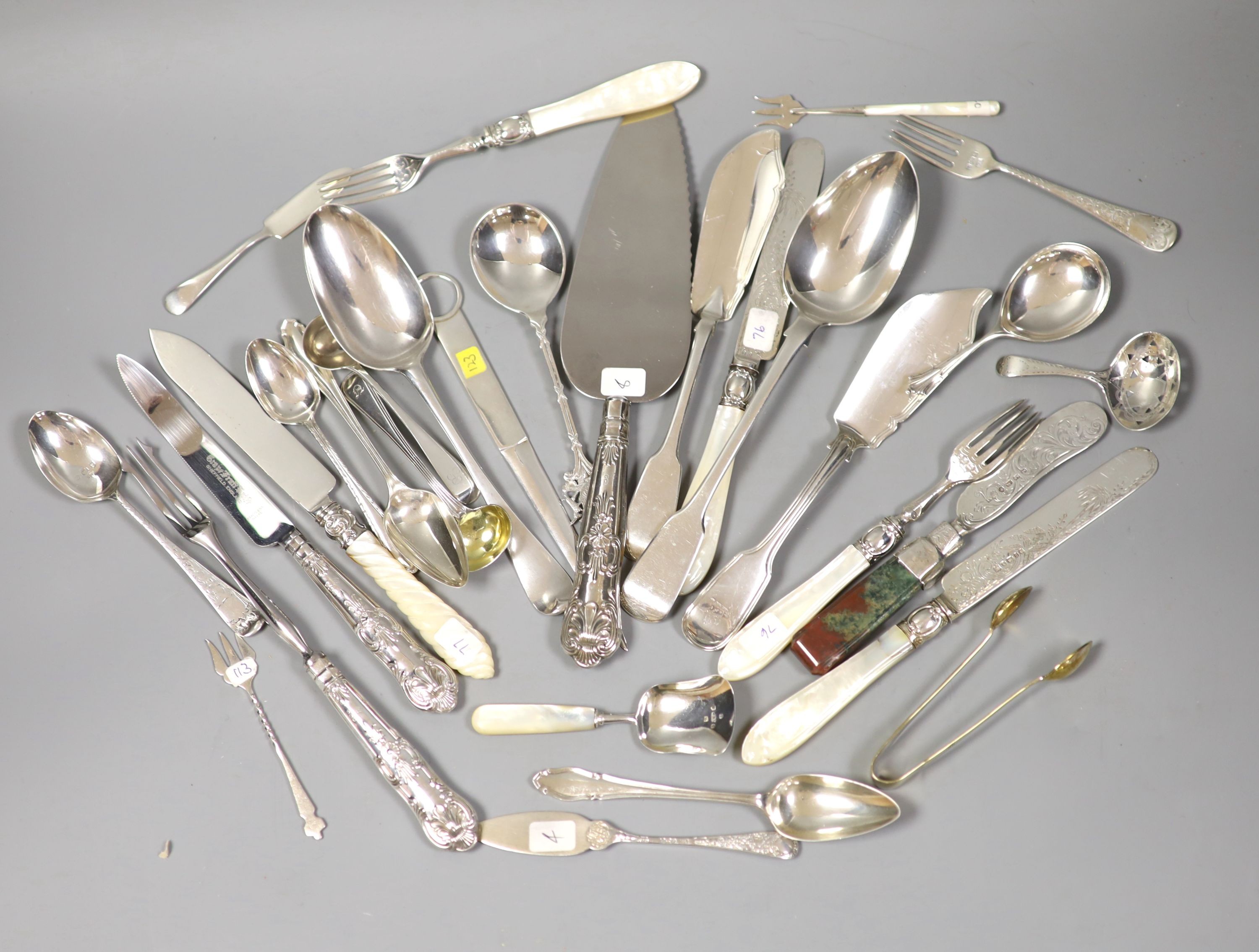 Four Victorian and later silver butter knives including Newcastle and a group of assorted silver flatware including two 19th century caddy spoons, tablespoons, letter opener and a Victorian agate handled butter knife.